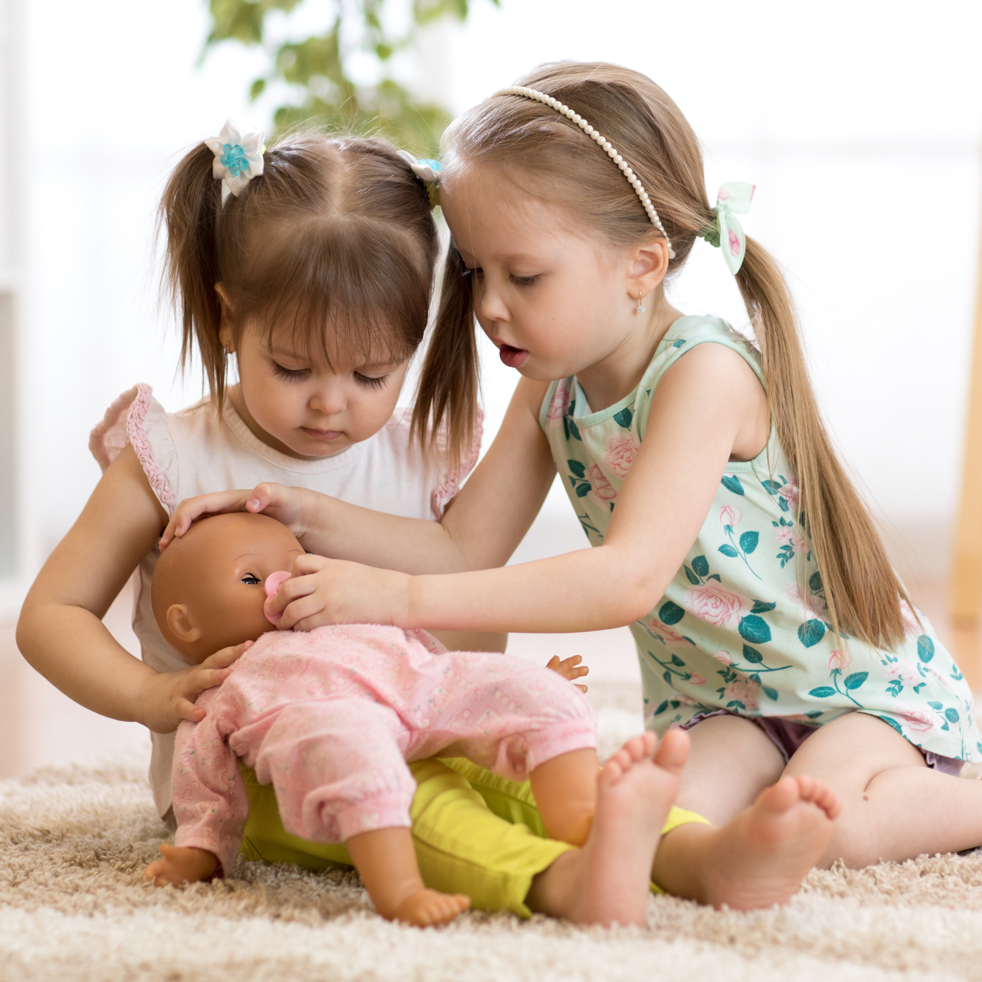 People playing hot sale with baby dolls